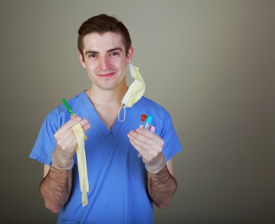 young male phlebotomist with equipment for drawing blood